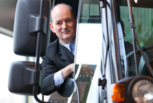 Martin Ritschel looking out the window of a Unimog truck